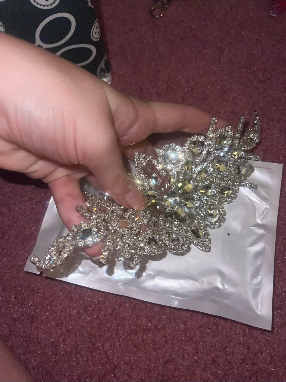 Silver embellishment for sewing.